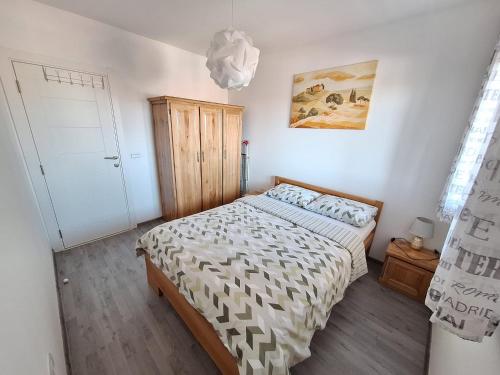 a bedroom with a bed in a room at Apartman Lilly in Modriča