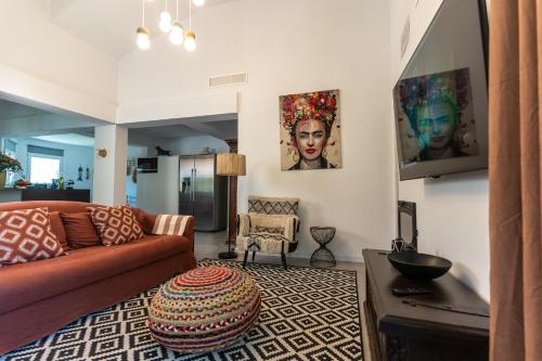 a living room with a couch and a table at Casa Dona in Denia