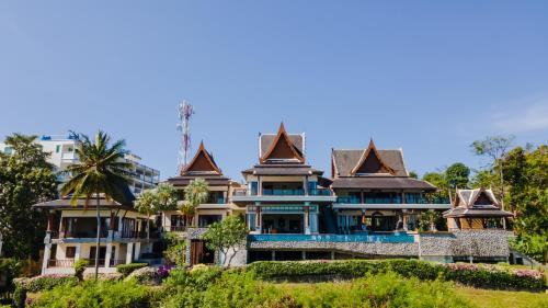 a large house with turrets at Grand View Panwa Luxury Villa in Ban Ao Makham