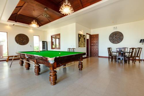 a pool table in the middle of a room at Grand View Panwa Luxury Villa in Ban Ao Makham