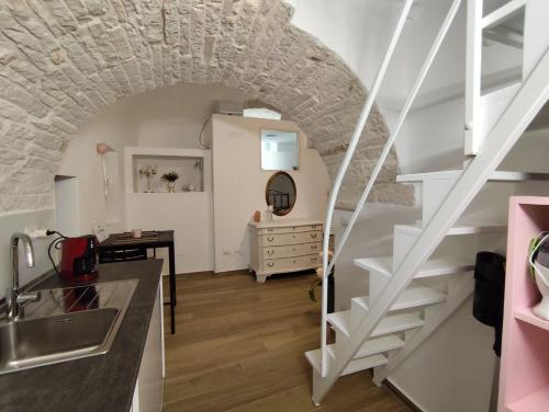 a kitchen with stairs leading up to a room at La Fiorita in Terlizzi