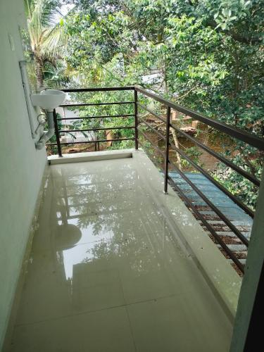 a view of a balcony with a metal railing at Aswathy Bhavan in Vadakkāncheri