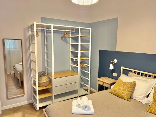 a bedroom with a bed and a dresser and a mirror at Gioia di Roma in Rome