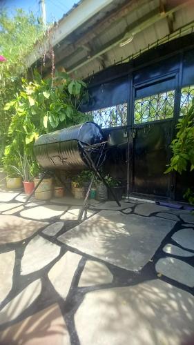 a bench sitting on a patio in front of a house at Mount Zion Guest House, Mtwapa Mtomondoni in Mombasa