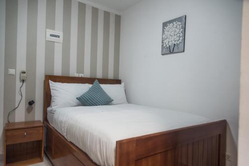 Cama o camas de una habitación en At home Douala Cameroun