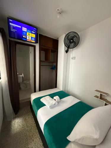 Ένα ή περισσότερα κρεβάτια σε δωμάτιο στο Roomies House By Rincon