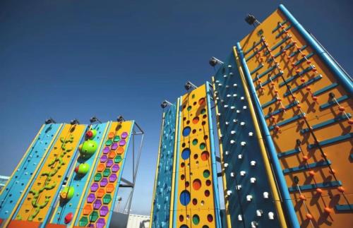 a row of buildings with a climbing wall at Haven allhallows in Allhallows