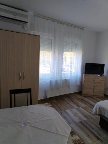 Postel nebo postele na pokoji v ubytování Apartman ZVEZDA