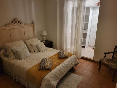 Ένα ή περισσότερα κρεβάτια σε δωμάτιο στο Appartement calme, authentique et spacieux au pied du GR20