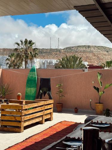 a surfboard sitting on top of a wall at TAMOUNT Surf House in Agadir