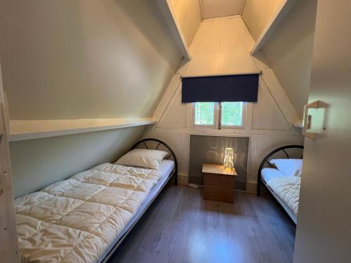 Giường trong phòng chung tại La Dolce Vita, Chalet 75, Vakantiepark Sunclass Durbuy