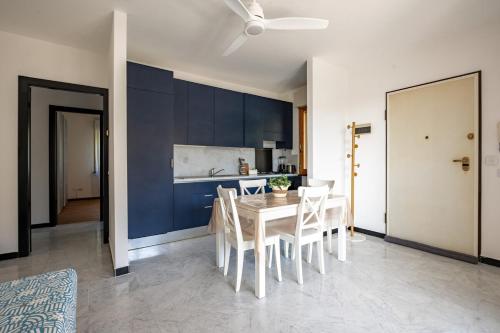a kitchen and dining room with a table and chairs at Approdo in Chiavari