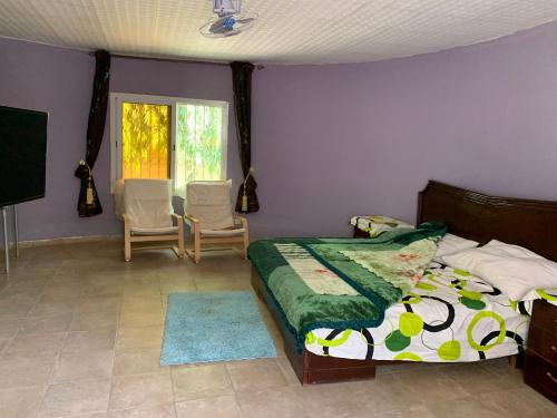 Ένα ή περισσότερα κρεβάτια σε δωμάτιο στο Auberge Kamalé