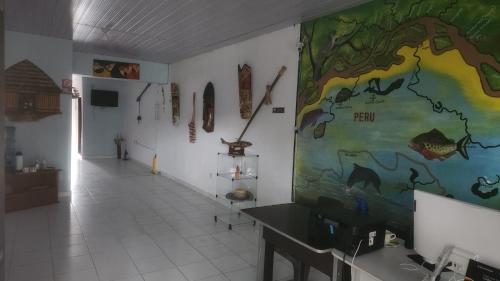 a room with a large painting on the wall at Alojamiento LETICIA in Leticia