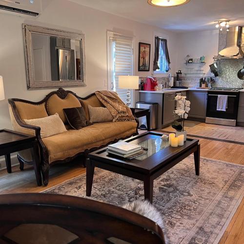 a living room with a couch and a coffee table at cozy retreat in upscale Green Hills in west Nashville in Nashville
