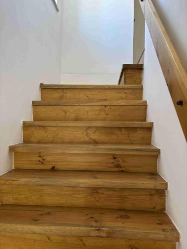 a stairway with wooden steps in a house at Chalupa U Pastvišť in Stachy