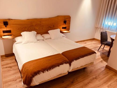 Letto o letti in una camera di A Reigada Hotel Restaurante