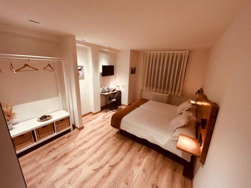 Letto o letti in una camera di A Reigada Hotel Restaurante