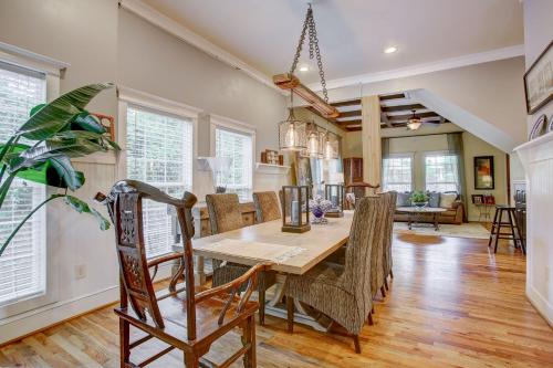 a kitchen and dining room with a table and chairs at Close to Downtown, 11-Person Swim Spa-Hot Tub, 75" TV 4 Movie Nights, Spacious, Walk To Restaurants, Ping Pong in Atlanta