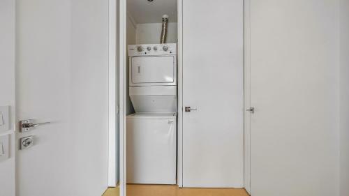 a kitchen with two refrigerators and a refrigerator at PH 10 - SoHo PV in Puerto Vallarta