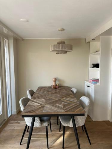 a dining room with a table and chairs at Beautiful entire house in the center in Medemblik