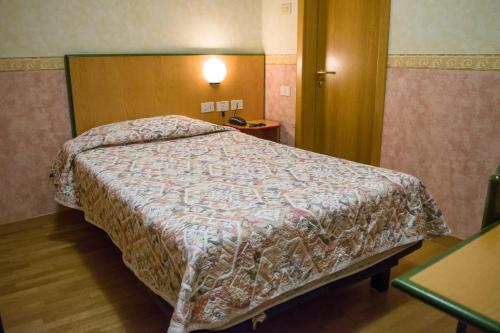 Hotel Baffo Rossoにあるベッド
