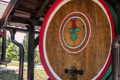 a large wooden barrel with a cross on it at Barrels by the Lake in Priles