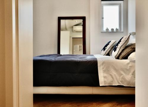 Ένα ή περισσότερα κρεβάτια σε δωμάτιο στο Il Nido d'amare
