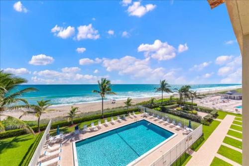 a view of the beach from the balcony of a resort at Hutchinson Island BeachFront Heated Pool Balcony Top Floor in Jensen Beach