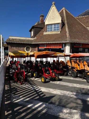 a group of scooters parked in front of a building at Trouville Palace Le Bonheur in Trouville-sur-Mer