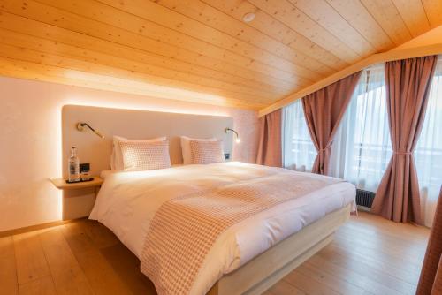 Postel nebo postele na pokoji v ubytování Grindellodge