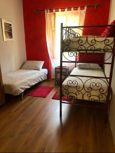 Ένα ή περισσότερα κρεβάτια σε δωμάτιο στο Ortensia casa vacanze
