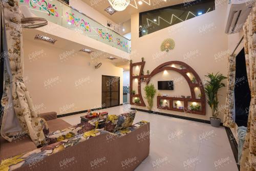 a lobby of a hotel with a waiting room at SEAs THE DAY LUXURIOUS 5BHK VILLA 2min From Awas Beach With Huge Private Pool in Alibaug