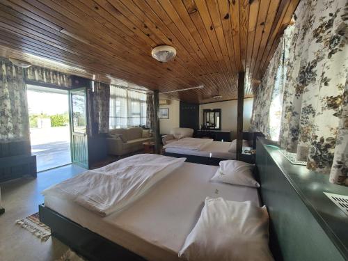 Postel nebo postele na pokoji v ubytování Hotel HAL-TUR