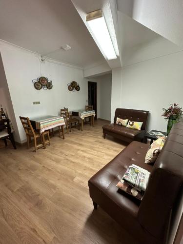 a living room with a couch and a table at Casa Rainha Dª Amélia in Termas de Sao Pedro do Sul
