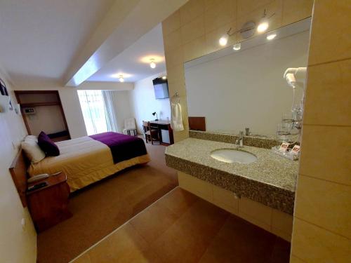 Postel nebo postele na pokoji v ubytování Hotel Munay Tambo