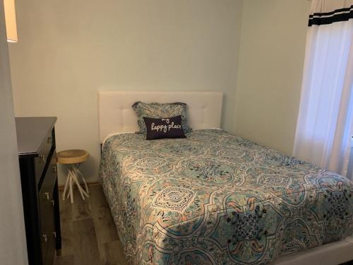 a bedroom with a bed with a pillow on it at Fully updated home with hot tub in amenity filled community in Lackawaxen