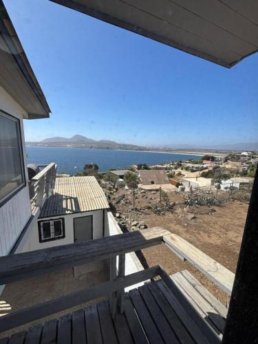 a balcony of a house with a view of the water at Cabaña Vista Mar in Tongoy