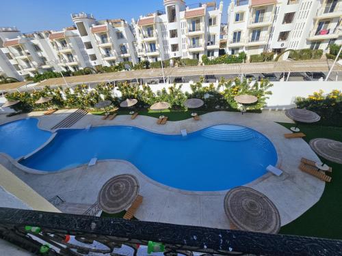 Bazén v ubytování Sharm Hills Aqua park Resort شرم هيلز اكوا بارك ريزورت nebo v jeho okolí