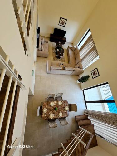 an overhead view of a living room with a table at C32 Samarah Resort LOFT apartment in Sowayma