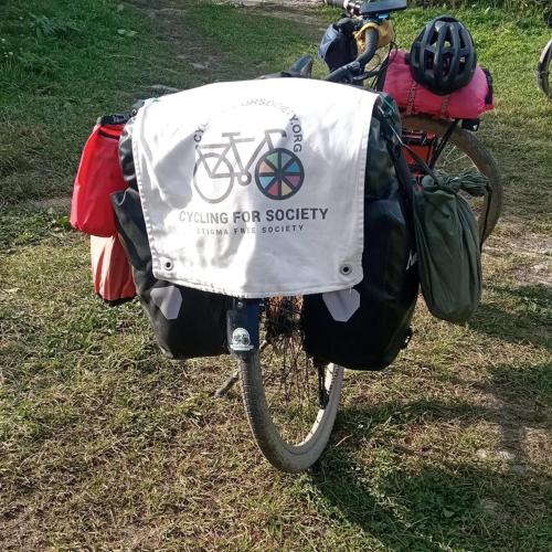 a bike with a bag on the back of it at Ushguli Terrace in Ushguli