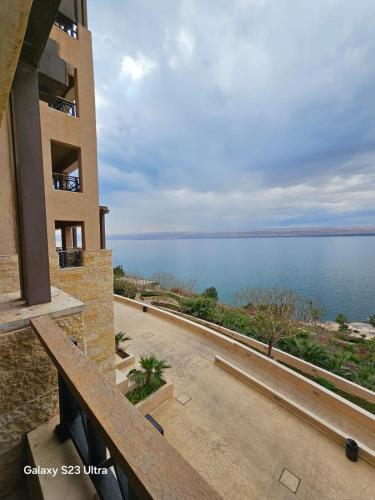 a view of the ocean from a building at E13 Samarah Resort Apartment in Sowayma