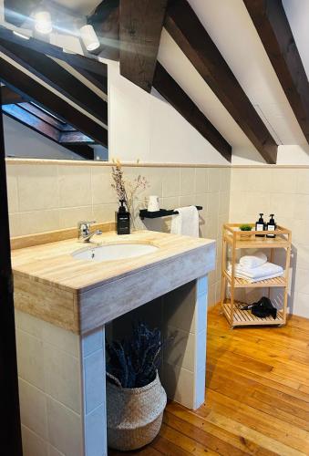 a bathroom with a sink in a room at Pensión Casa Arenas in Arenas de Cabrales