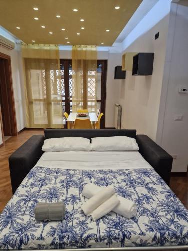 a large bed with two pillows on top of it at Moonlight Apartment in Fiumicino