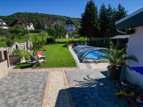 a view of a backyard with a swimming pool at Pension Zur Krone in Martinfeld