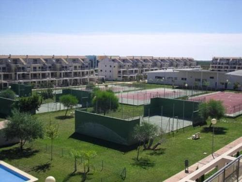 a tennis court with two tennis courts in a city at Special place to rest and enjoy in San Jorge Castellon in Sant Jordi
