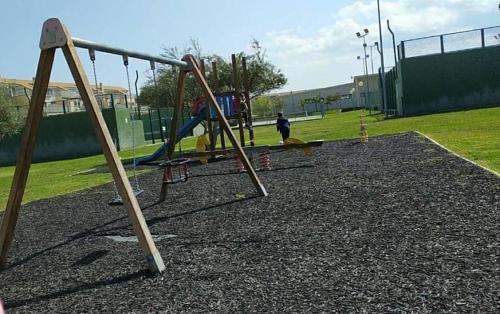 an empty playground with a swing set in a park at Special place to rest and enjoy in San Jorge Castellon in Sant Jordi