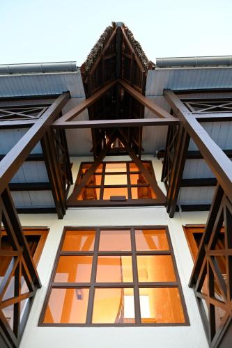 a view from the inside of a building with windows at Hôtel Baobab Café in Morondava