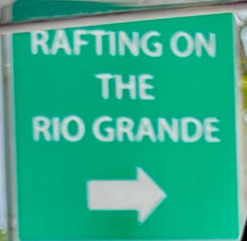 a green sign that says riding on thero grandride at Portland Jamaica! Green and Lush! Volcano and Falls Yes! in Lenox
