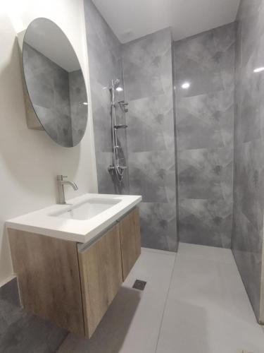 a bathroom with a sink and a shower at Modern & Stylish Condo Rental P52 in Lapu Lapu City